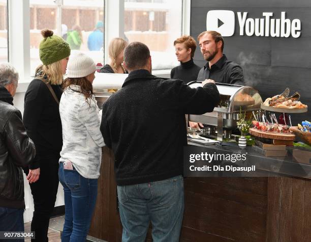 Guests in the food line during the Respect Rally Park City Post Reception at the YouTube House on January 20, 2018 in Park City, Utah.