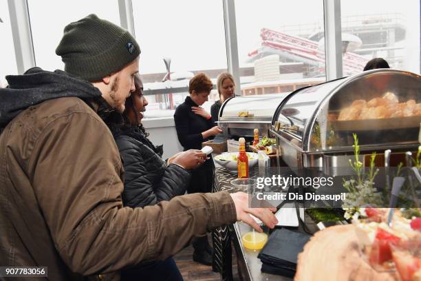 Guests in the food line during the Respect Rally Park City Post Reception at the YouTube House on January 20, 2018 in Park City, Utah.