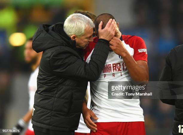 West Bromwich Albion Manager Alan Pardew consoles Salomon Rondon of West Bromwich Albion after his tackle on James McCarthy of Everton during the...