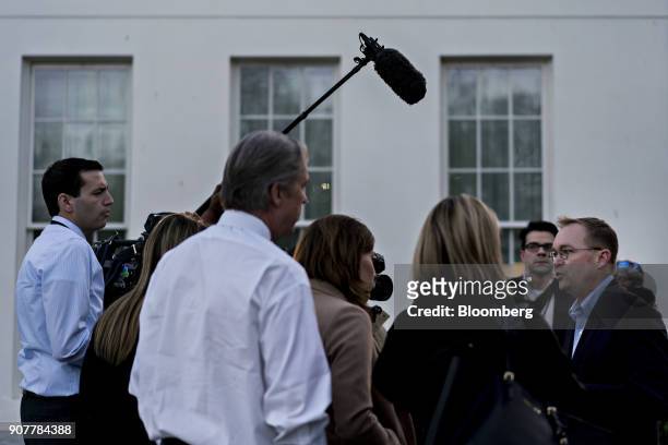 Mick Mulvaney, director of the Office of Management and Budget , right, speaks to members of the media outside the White House in Washington, D.C.,...