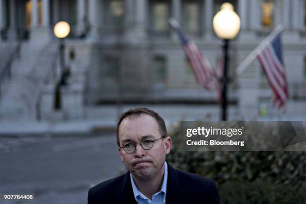 Mick Mulvaney, director of the Office of Management and Budget , pauses while speaking to members of the media outside the White House in Washington,...