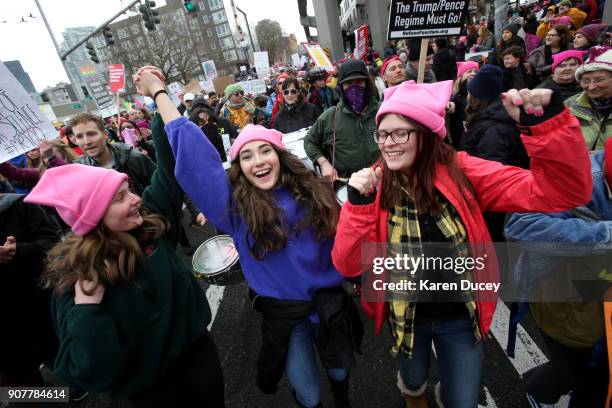 Katy Bordonaro, Dima Minkin, and Alyssa Bordonaro from Woodinville, WA march with thousands in the Women's March on January 20, 2018 in Seattle,...