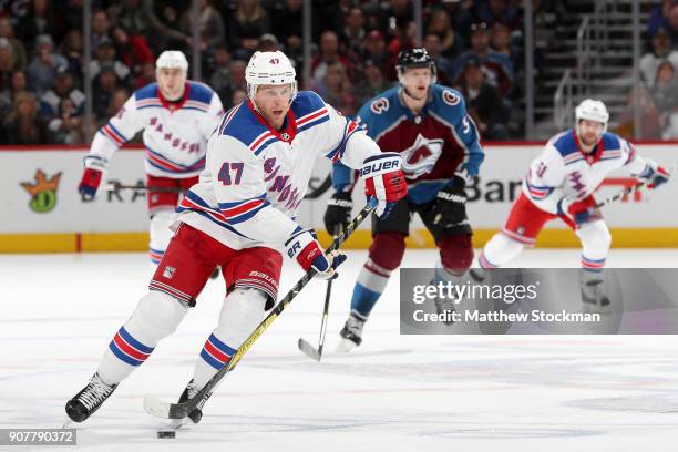 Steven Kampfer of the New York Rangers brings the puck down the ice against the Colorado Avalanche at the Pepsi Center on January 20, 2018 in Denver,...