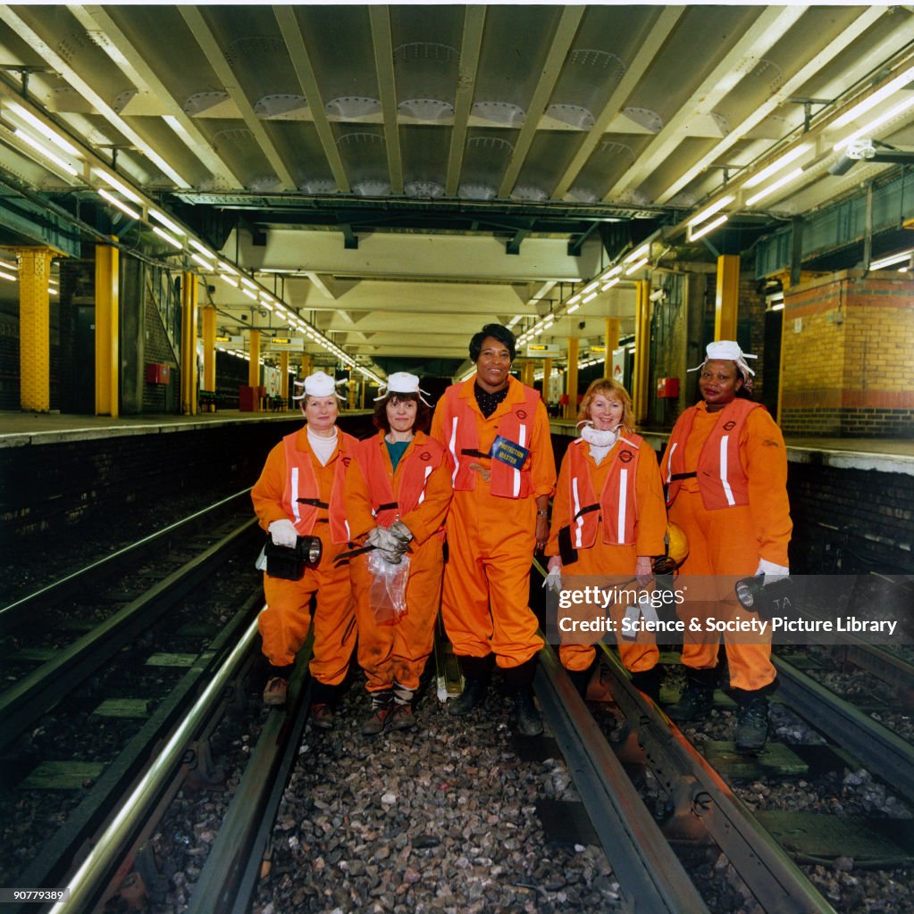 Simp Fluffer A team of 'fluffers' working at Whitechapel Station on the District ...