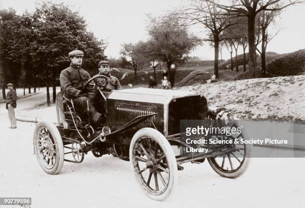 Photograph from an album of images compiled by English motorist, motor car manufacturer and aviator Charles Stewart Rolls , showing him at the wheel...