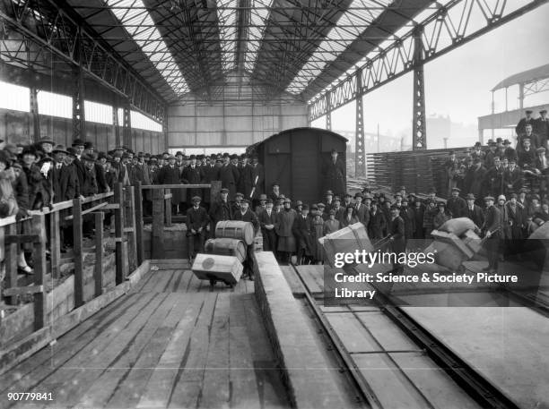 Opening of new goods depot, Paddington station, London, March 1926. Officials and guests watch as porters transfer goods from the old, partially...