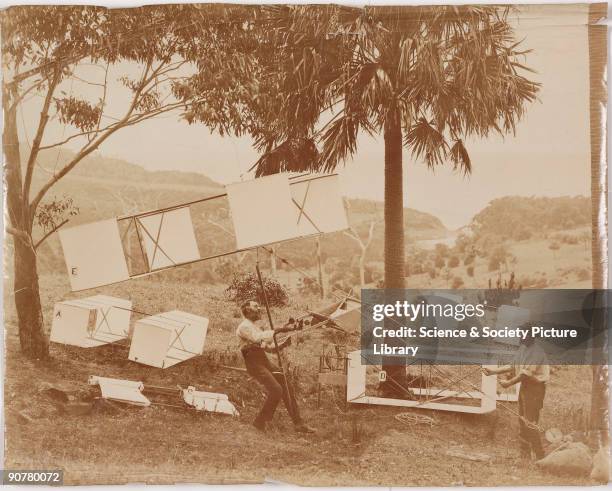 Photograph showing two men with box kites of the type designed by Lawrence Hargrave , the English-born Australian aeronautical pioneer. Hargrave...