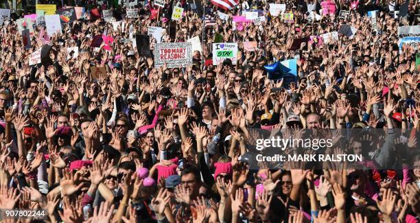 Protesters, part of a 500,000 strong crowd, attend the Women's Rally on the one-year anniversary of the first Women's March in Los Angeles,...