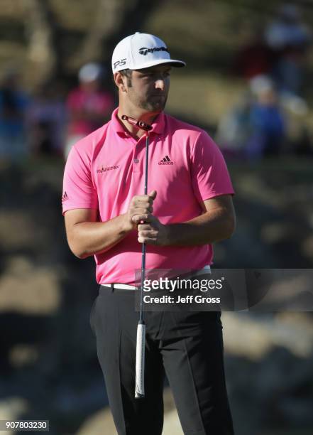 Jon Rahm of Spain reacts to his putt on the 17th hole during the third round of the CareerBuilder Challenge at the TPC Stadium Course at PGA West on...