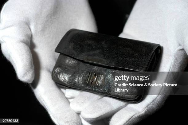 This wallet was raised two and half miles from the debris field around the �Titanic� 90 years after the ship sank, and is shown here at the Science...