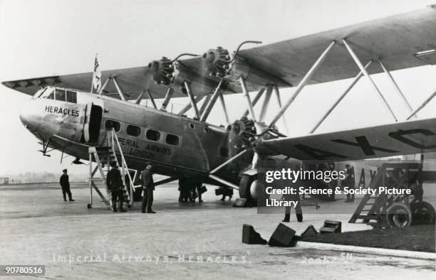 Heracles' boarding passengers, possibly from Croydon Airport, Greater London. The Handley Page HP42 was the most famous Imperial Airways airliner of...