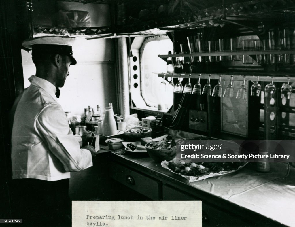 The steward prepares lunch in the galley of an Imperial Airways Scylla, 1934.