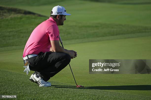 Jon Rahm of Spain lines up a putt on the 16th hole during the third round of the CareerBuilder Challenge at the TPC Stadium Course at PGA West on...