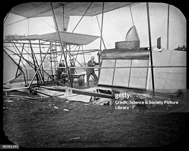 Photograph showing Maxim examining the wreckage. Sir Hiram Stevens Maxim designed and built this flying machine in 1893-1894. He had previously found...