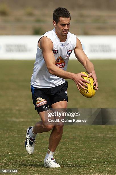 Daniel Giansiracusa of the Bulldogs kicks during a Western Bulldogs AFL training session at Whitten Oval on September 15, 2009 in Melbourne,...