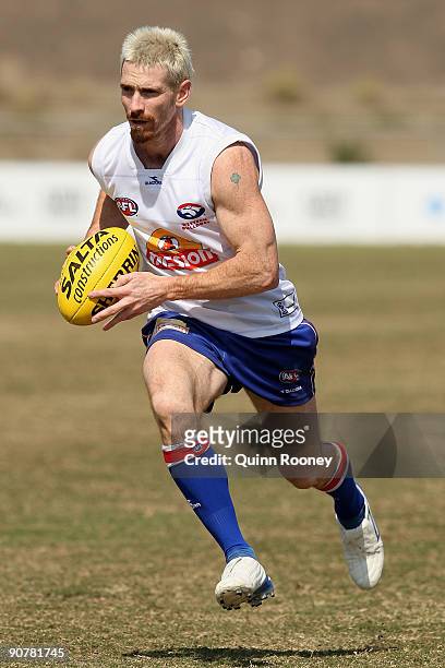 Jason Akermanis of the Bulldogs looks to kick the ball during a Western Bulldogs AFL training session at Whitten Oval on September 15, 2009 in...