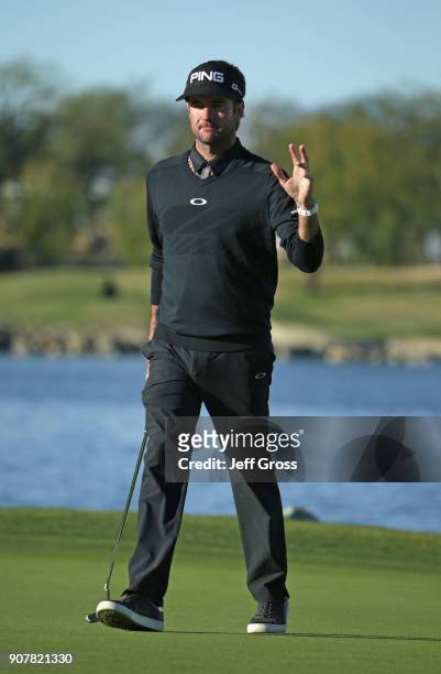Bubba Watson reacts to his putt on the 18th hole during the third round of the CareerBuilder Challenge at the TPC Stadium Course at PGA West on...