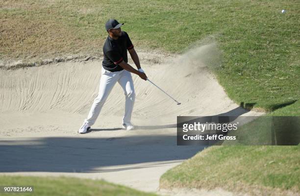 Harold Varner III plays his shot out of the bunker on the ninth hole during the third round of the CareerBuilder Challenge at the TPC Stadium Course...