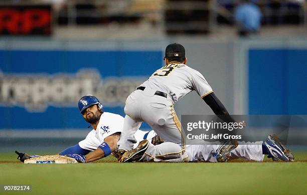 Matt Kemp of the Los Angeles Dodgers slides under the tag of Ronny Cedeno of the Pittsburgh Pirates and steals second base in the fifth inning at...