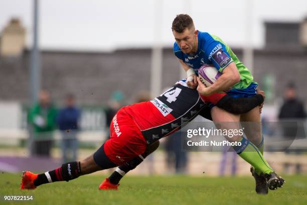 Matt Healy of Connacht tackled by Daniel Ikpefan of Oyonnax during the European Rugby Challenge Cup Round 6 between Connacht Rugby and Oyonnax at the...