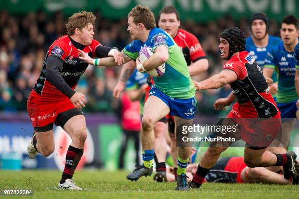 Kiernan Marmion of Connacht tackled by James Hall and quentin MacDonald of Oyonnax during the European Rugby Challenge Cup Round 6 between Connacht...