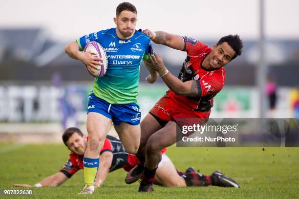 Caolin Blade of Connacht tackled by Ulupano Seuteni of Oyonnax during the European Rugby Challenge Cup Round 6 between Connacht Rugby and Oyonnax at...