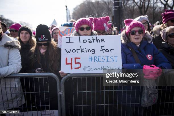 Demonstrator holds a sign that reads "I Loathe Working For 45 #Resist" during the second annual Women's March Chicago in Chicago, Illinois, U.S., on...