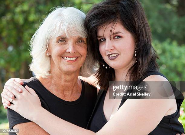 baby boomer woman with goth granddaughter - goth-family stock pictures, royalty-free photos & images