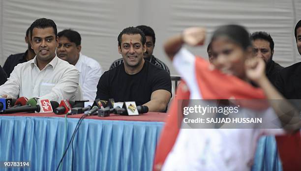 Entertainment-India-Bollywood-people-Khan,FOCUS by Shail Kumar Singh Indian cinema actor Salman Khan sits alongside Congress MP Milan Deora as they...