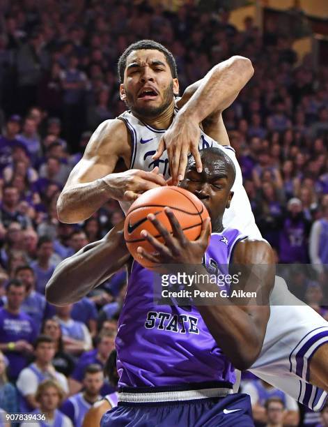Kenrich Williams of the TCU Horned Frogs comes over the top of Makol Mawien of the Kansas State Wildcats for a foul during the second half on January...