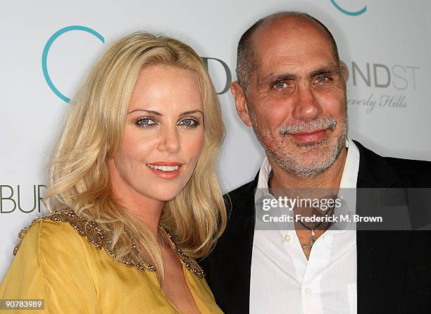 Actress Charlize Theron and director Guillermo Arriaga attend the "The Burning Plain" film premiere at Bond Street Thompson Beverly Hills on...