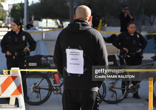 Protesters, part of a 500,000 strong crowd, attend the Women's Rally on the one-year anniversary of the first Women's March in Los Angeles,...