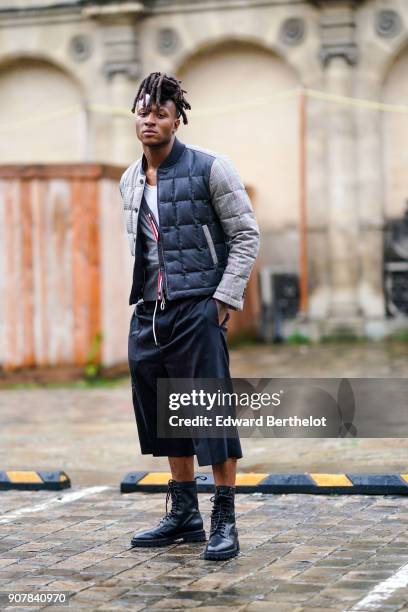 Deandre Hopkins wears a puffer coat, cropped pants, outside Thom Browne, during Paris Fashion Week - Menswear Fall Winter 2018-2019, on January 20,...