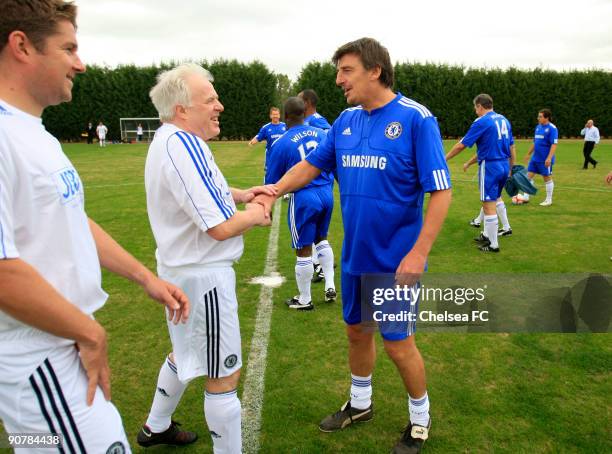 Chelsea captain Colin Pates shakes hands with JDRF captain Tony Reeves before a Chelsea Old Boys match at the club's Cobham training ground on...