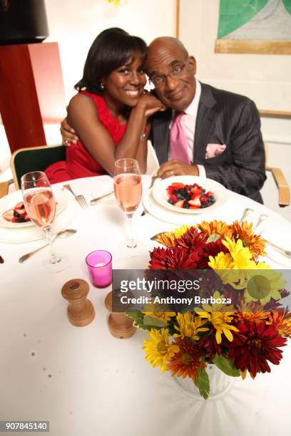 Portrait of married television journalists Deborah Roberts and Al Roker as they pose together at a breakfast table, New York, November 16, 2010.