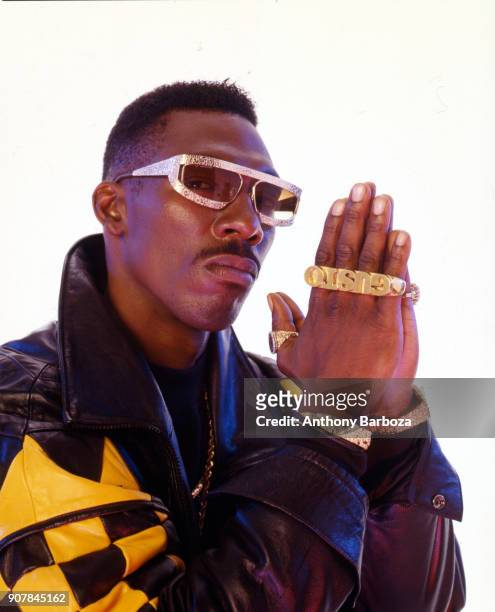 Portrait of American actor and comedian Charlie Murphy , in costume for his role in the film 'CB4' , as he poses in front of a white background, New...