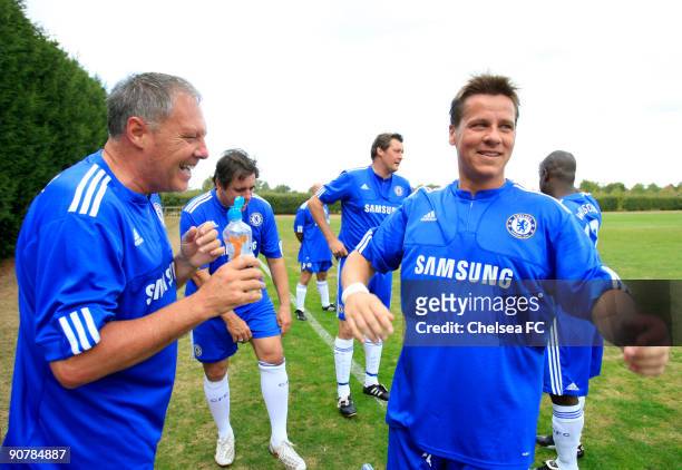 Chelsea's Tommy Langley and Darren Barnard share a joke at halftime during a Chelsea Old Boys match at the club's Cobham training ground on September...