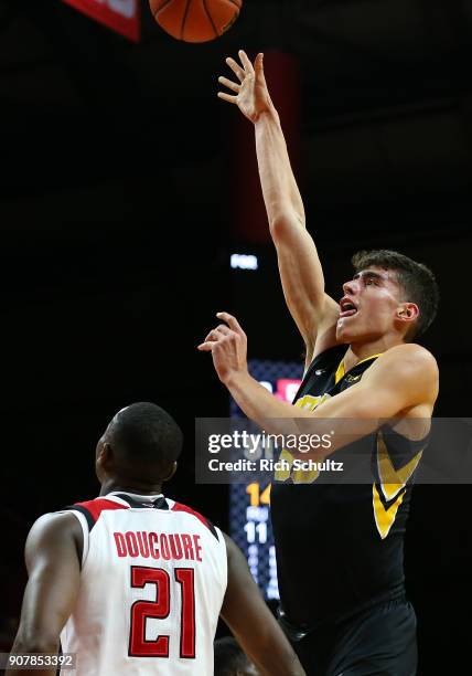 Luka Garza of the Iowa Hawkeyes in action against Mamadou Doucoure of the Rutgers Scarlet Knights during a game at Rutgers Athletic Center on January...