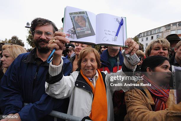 Supporter Helga Schuetz shows a signature of German Chancellor Angela Merkel during an election rally on September 15, 2009 in Koblenz, Germany....