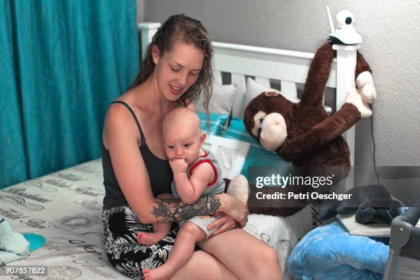 bonding with mom. - laughing monkey stock pictures, royalty-free photos & images