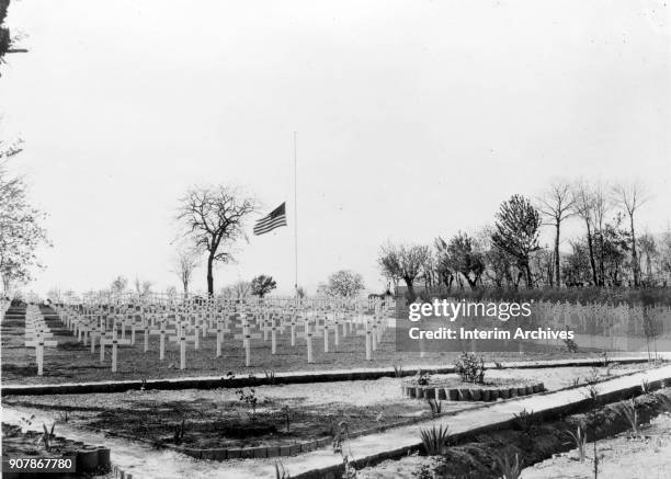 An American flag flies at half mast in tribute over the American cemetery, near Cassino, Italy, April 16, 1945. US President Franklin Delano...