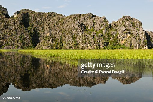 Reflection of mountains at Van Long Nature Reserve, Ninh Binh Province, Vietnam Reflection of mountains at Van Long Nature Reserve, Ninh Binh Province, Vietnam