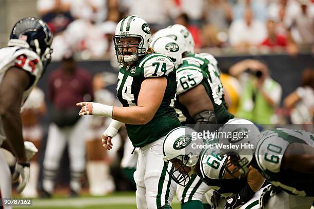 Nick Mangold of the New York Jets points to his blocking assignment against the Houston Texans at Reliant Stadium on September 13, 2009 in Houston,...