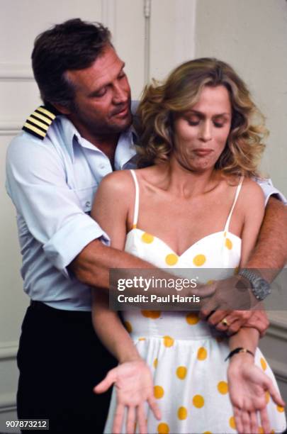 "nBEVERLY HILLS, CA Supermodel Lauren Hutton and Actor Lee Majors joke around at a press conference announcing the release of Starflight: The Plane...