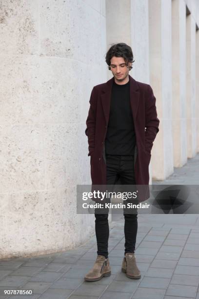 Actor Jack Brett Anderson wears Giuseppe Zanotti boots, River Island jacket, jeans and sweater day 2 of London Mens Fashion Week Autumn/Winter 2018,...
