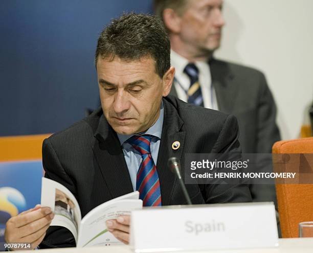 Spain's Agriculture Minister Josep Puxeu reads a brochure during the last day of the informal meeting of EU agriculture and fisheries ministers, in...