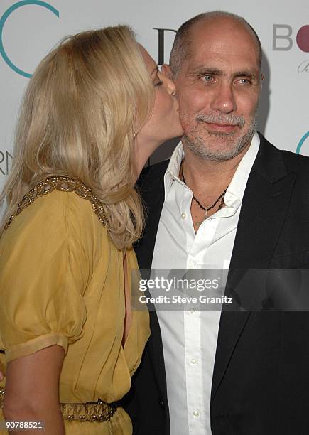 Charlize Theron and Guillermo Arriaga arrives at the Los Angeles premiere of "The Burning Plain" at the Thompson Hotel on September 14, 2009 in...