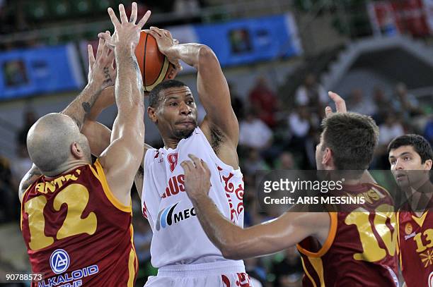 Russia's Kelly Mc Carty is marked by Pero Antic of F.Y.R. Of Macedonia during their 2009 European championship qualifying round, group E, basketball...