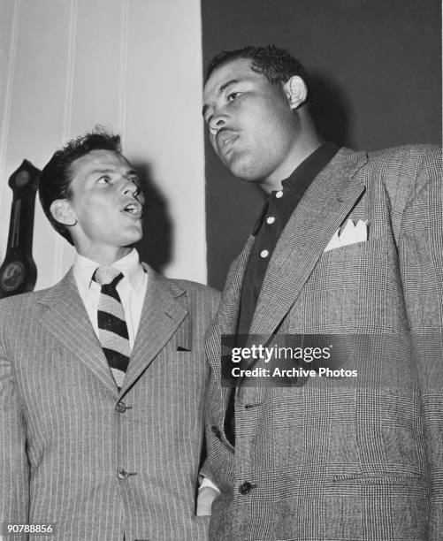 American actor and singer Frank Sinatra with his friend, heavyweight boxer Joe Louis , circa 1947.