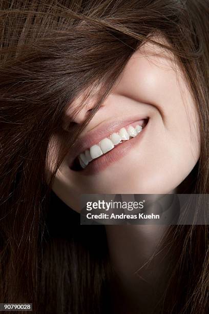 young woman with happy smile, close up. - viso nascosto foto e immagini stock